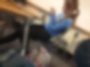 Adorable college teen sitting in class bored