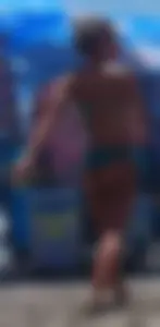 Sexy blonde on the beach in a teal thong bikini with nice ass