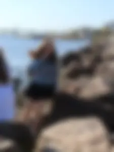 Skinny Girl in a Skirt on a Rocky Sea Shore - Thin Legs Teen Candid