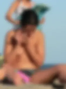 Sexy girls going topless at the beach showing off their sexy bodies