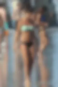 Beach girl out in a bikini with a nice round big booty
