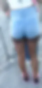 Tight skinny female in denim shorts ebony
