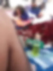 Sexy brunette teen in blue swimsuit by the pool