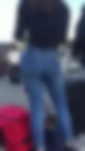 Teen in jeans pants bend over
