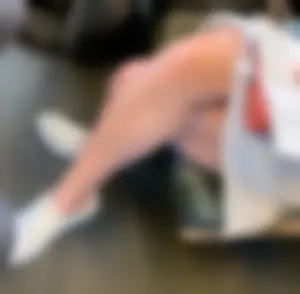 Nice crossed legs in a dress closeup in a public bus