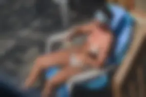 Creepshots of a neighbor milf in a bikini while sunbathing