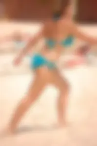 Assortment of sexy babes at the beach in bikinis