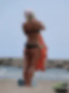 Tattooed blonde with big tits topless and in thong