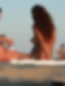 Sexy girls going topless at the beach showing off their sexy bodies