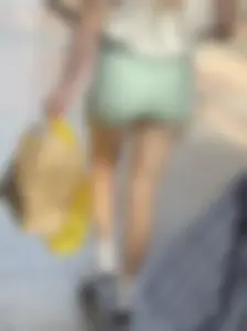 Sexy blonde in green shorts