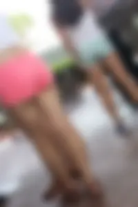 Sexy girl in pink shorts showing some cheek