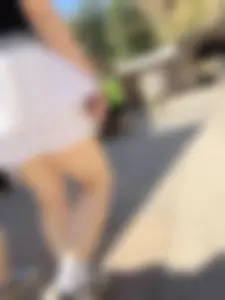 Closeups of a hot girl’s pale legs, she’s wearing a skirt