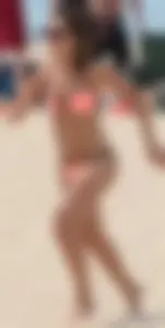Girl in peach bikini on the beach with a great body and great ass