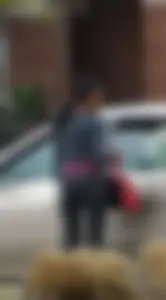 Ebony babe getting into her car with a great ass in grey leggings