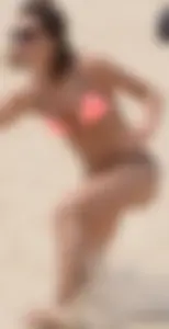 Girl in peach bikini on the beach with a great body and great ass