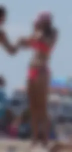Sexy and skinny girl on the beach in pink bikini