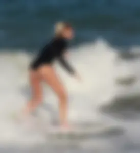 Hot surfer chicks out in the water