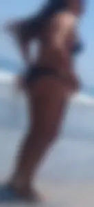 Thick brunette beach babe booty in a little black bikini
