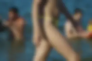 Milf in Yellow Swimsuit Beach Candid Gallery