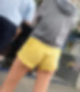 Skinny ass eating her yellow shorts