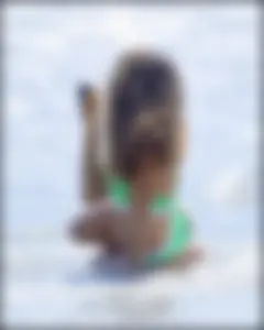 Super hot beach babe with a perfect body in a green thong bikini