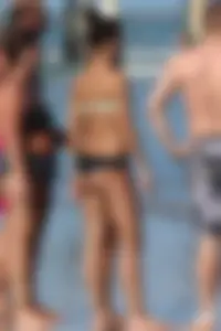 Beach girl out in a bikini with a nice round big booty