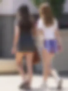 Sexy teen with glasses showing ass cheeks in shorts and friend in tight dress