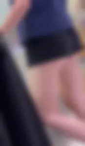 Sexy fit ass in mini shorts and slim legs closeups