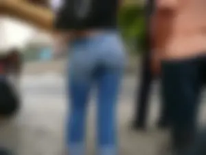 Red haired lady with a nice ass in tight jeans waiting for the bus
