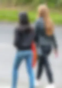 Redhead and ethnic skinny teens in tight jeans