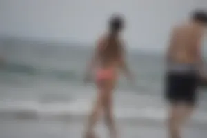 Peach bikini tattood babe on the beach with a nice ass and some camel toe