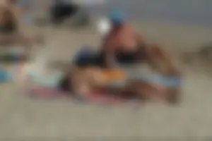 Girls on a nude beach in Sitges, Spain