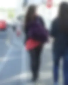 Girl in a pink skirt and stockings accidentally showing some cheek