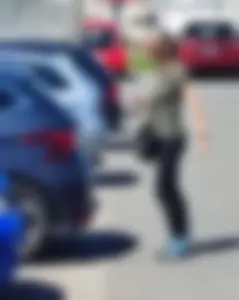Skinny blonde milf at parking lot