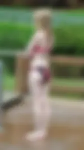 Pale strawberry blonde bikini girl at a water park
