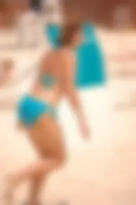 Assortment of sexy babes at the beach in bikinis
