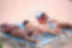 Assortment of sexy babes at the beach in bikinis