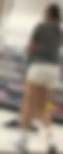 Amazing Asian in white yoga shorts upshot bends squat at Target