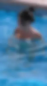 Sexy pool teen with big boobs barely staying in her top