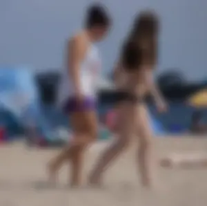 Sexy beach brunette in teal top and black bottom bikini