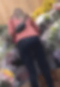 asian round booty looking for flowers at Trader joes