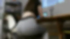 Girlfriend with a sexy big booty sitting in grey leggings