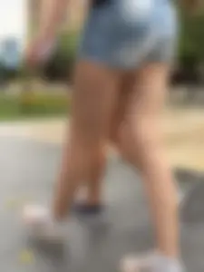 Candid teen wearing denim shorts passing by, nice legs
