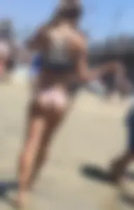 Sexy skinny beach chick with a tight little ass in a thong bikini