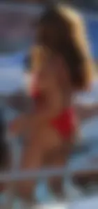 Sexy black girl in red swimsuit at the pool with side boob and a nice ass