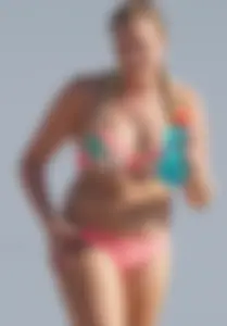 Thick blonde bikini babe on the beach