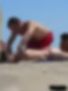 Purple thong topless lady on the beach gets oiled up by her husband