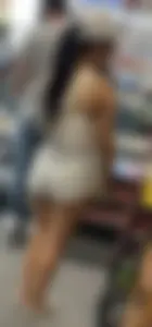 Sexy fit latina with cheeks coming out of booty shorts