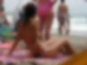 Hot topless girl on the beach in a thong bikini with a nice ass