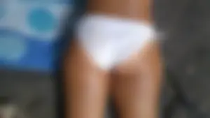 Sexy bikini ass laying out on the rocks up close